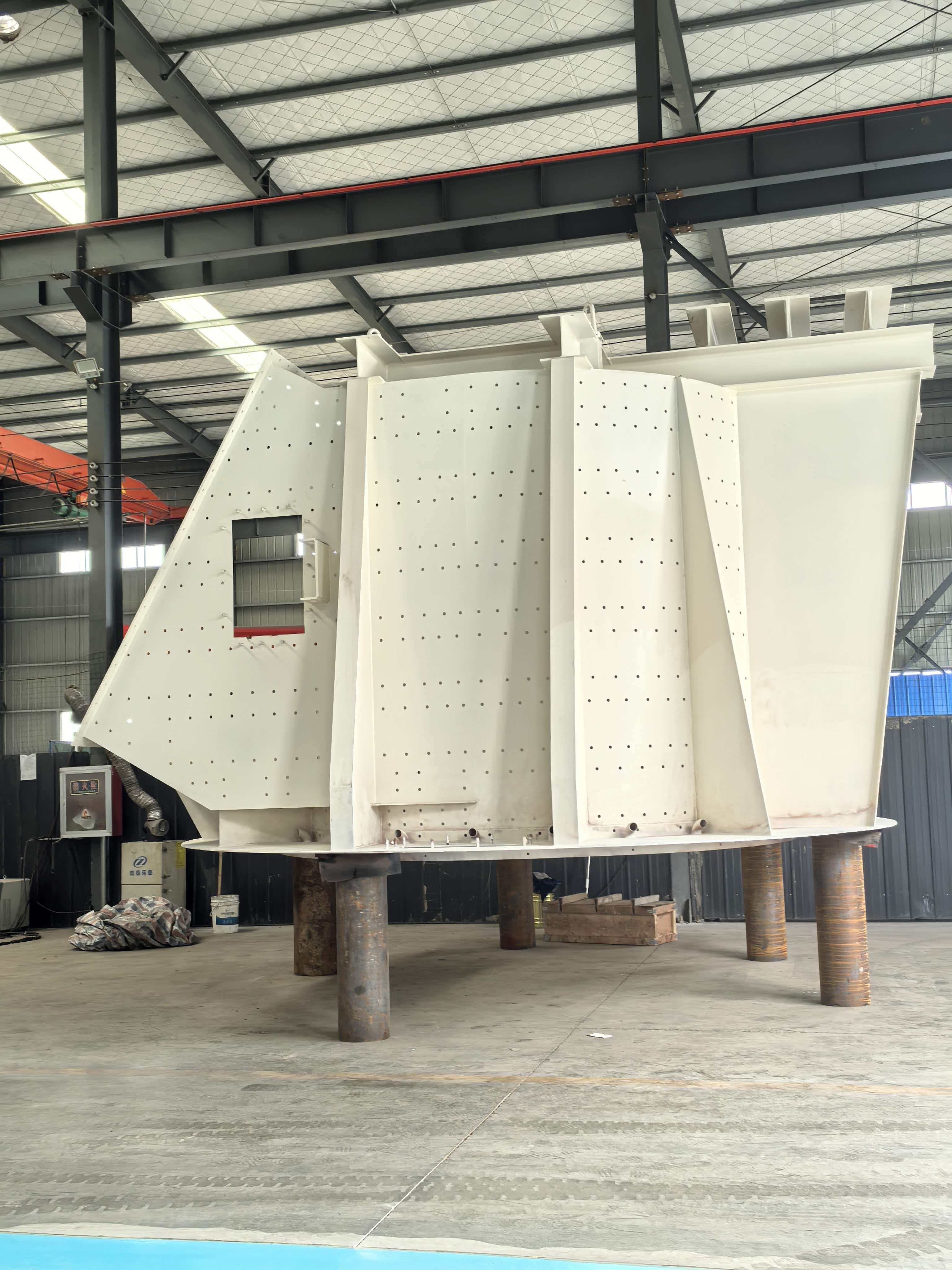White fabricated mining hopper in workshop